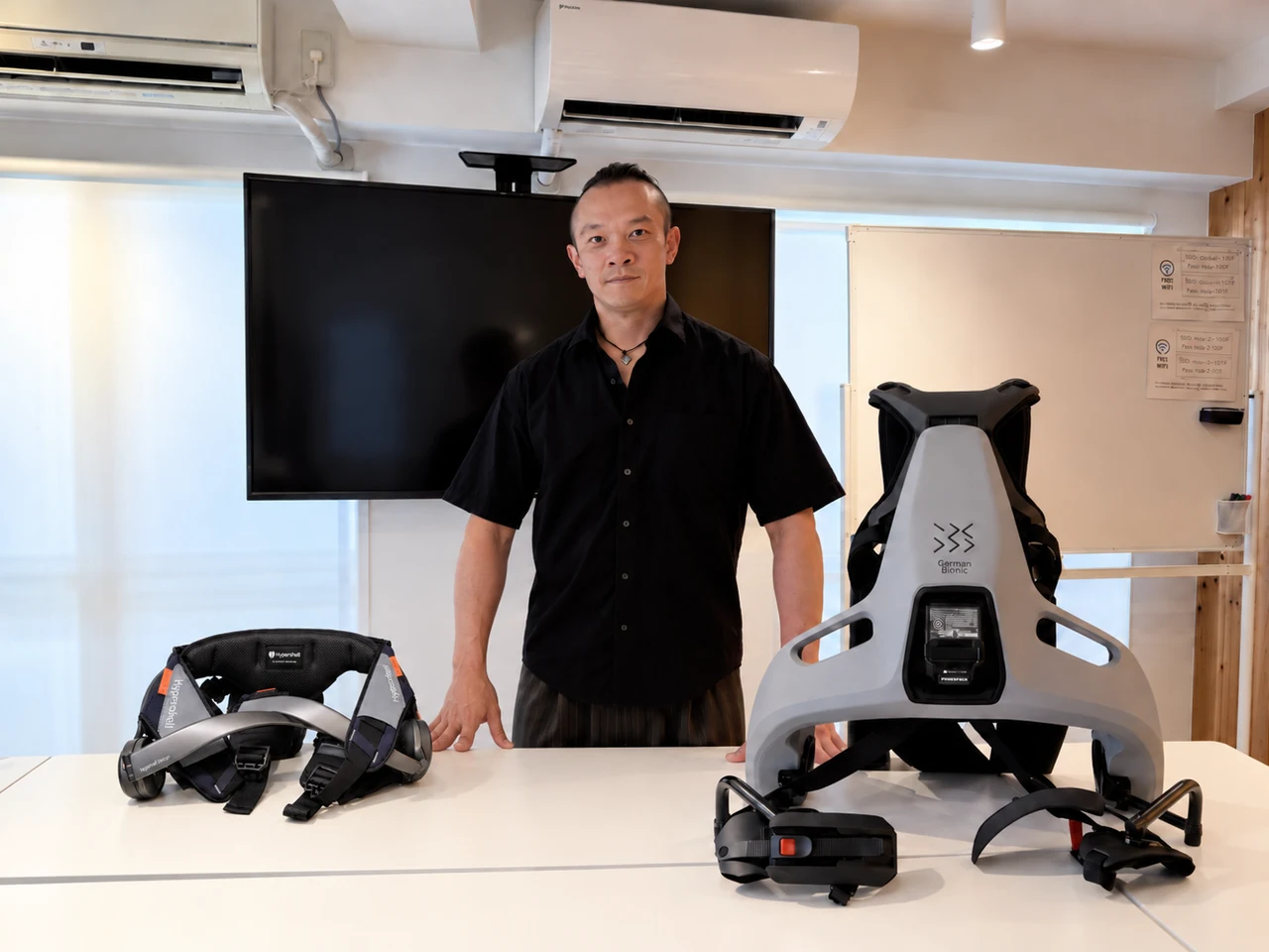 Founder MacClain Figueroa standing with the German Bionic and Hypershell mobility devices used in the Radventurers Mobility Lab story.